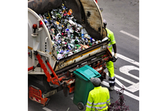 Waste truck collecting litter.